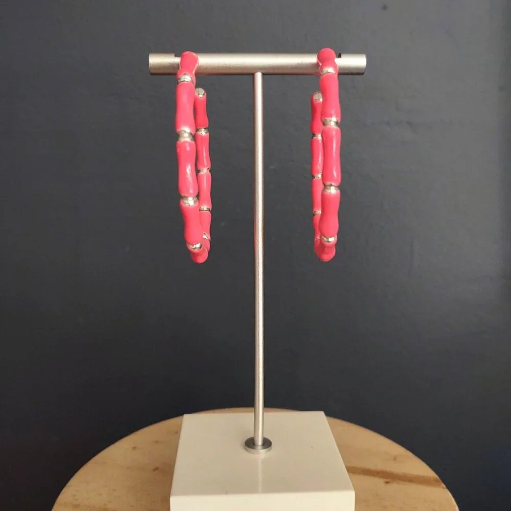 Bright glossy salmon pink enamel and silver tone hoops